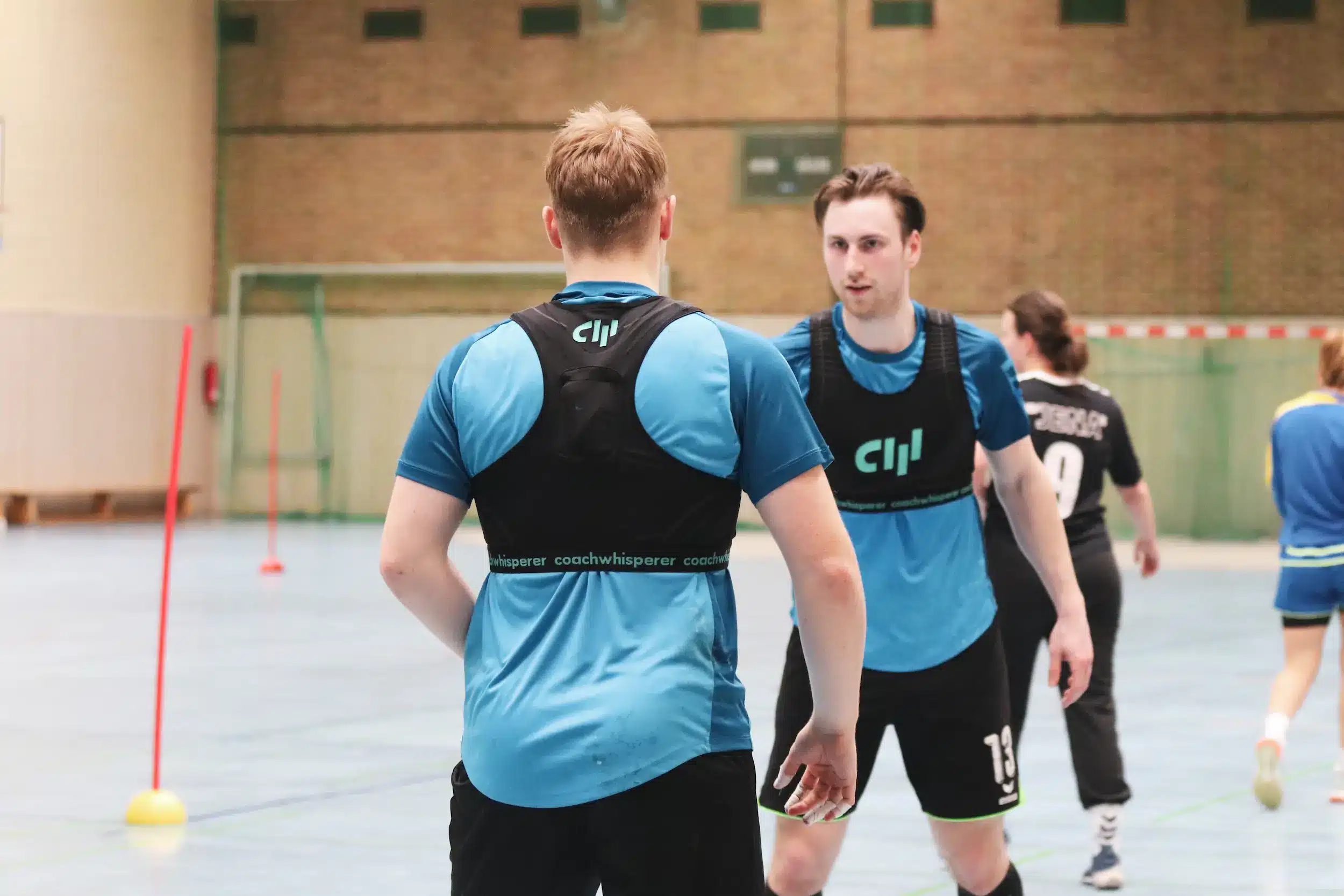 Handball players wearing the Soundstar while training with the Coachwhisperer